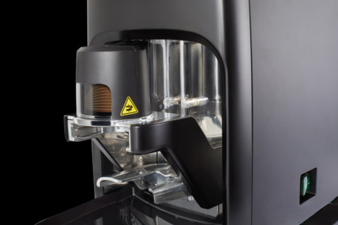 Close-up of Cimbali Elective Auto Tamper espresso grinder in black showing grinding mechanism and build quality - Cimbali Elective Auto Tamper Grinder Black – Precision Close-Up View - Detail view of the Cimbali Elective Auto Tamper grinder in black, engineered for precision espresso grinding.