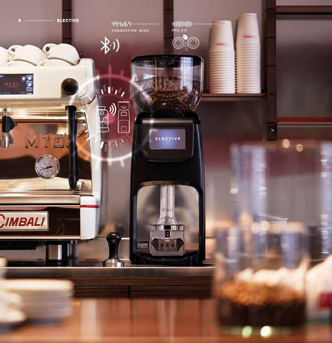 La Cimbali Elective Manual Tamper grinder connecting with M100 espresso machine in a café environment - La Cimbali Elective Manual Tamper Grinder – Café-Ready Integration with M100 - The Elective Manual Tamper grinder perfectly pairs with La Cimbali’s M100 espresso machine — ideal for seamless, Bluetooth-enabled café workflows.