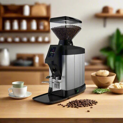 Cimbali G-50 coffee grinder on a modern kitchen countertop with coffee beans and a cup of espresso -Cimbali G-50 Coffee Grinder – Elegant & Intelligent Grinding for Perfect Espresso - Elevate your countertop with the Cimbali G-50—precision, performance, and style in one grinder.